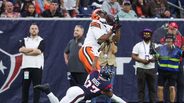 Dec 24, 2023; Houston, Texas, USA; Cleveland Browns wide receiver Amari Cooper (2) makes a reception and scores a touchdown as Houston Texans cornerback D'Angelo Ross (37) defends during the second quarter at NRG Stadium. 